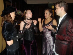 Hope, Leanna, EKM and Jason talk costumes, apparently serious business.