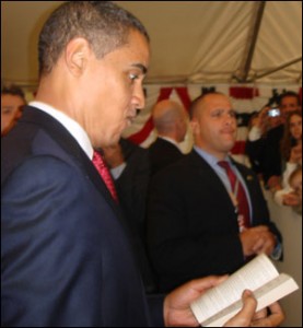 The President thumbing through yes, a romance novel.